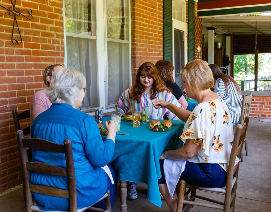 Ladies dining outside on porch